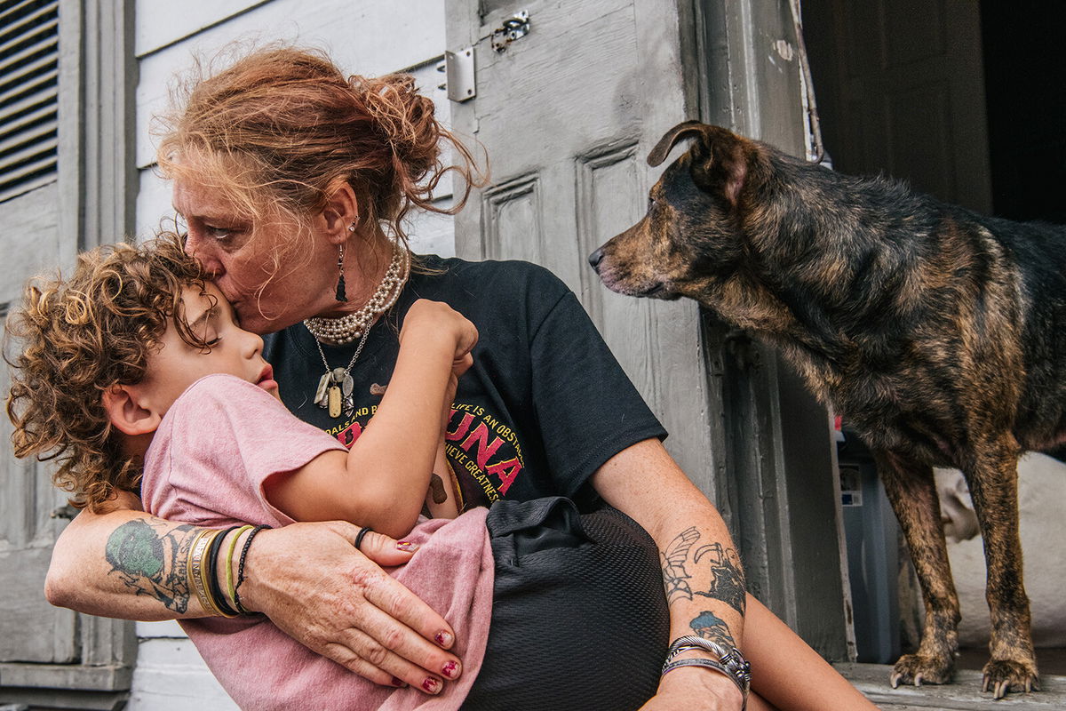 <i>Brandon Bell/Getty Images North America/Getty Images</i><br/>Ann Colette Boudreaux comforts her grandson Abel ahead of Hurricane Ida on August 29