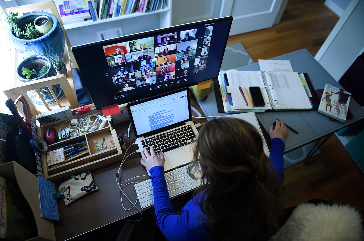 <i>Olivier Douliery/AFP/Getty Images</i><br/>Shares of Zoom plunged more than 15% Tuesday morning. Pictured is a school teacher working from her home due to the Coronavirus outbreak on April 1