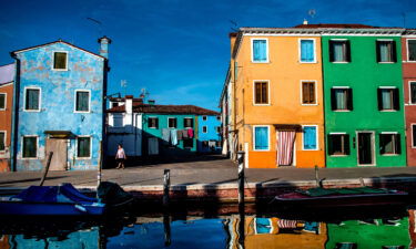 Tourists can line up in hundreds-strong queues to visit the pretty island of Burano.