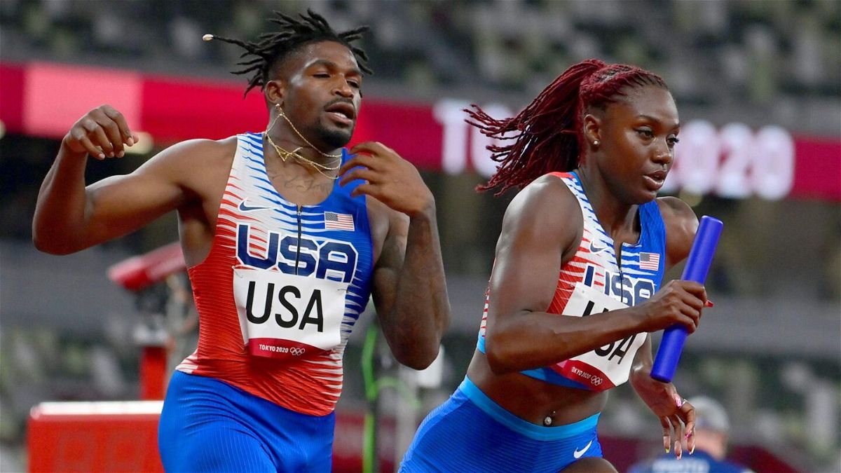 <i>JAVIER SORIANO/AFP/Getty Images</i><br/>USA's Elija Godwin and Lynna Irby compete in the mixed 4x400m relay heats during the Tokyo 2020 Olympic Games on July 30.