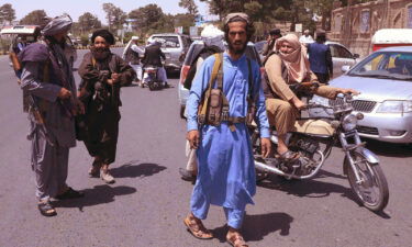 Taliban fighters patrol the streets in Herat on August 14.