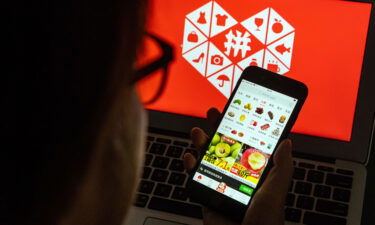 E-commerce firm Pinduoduo is giving its entire profit for last quarter back to rural China. The Pinduoduo application is seen here on a smartphone in Hong Kong