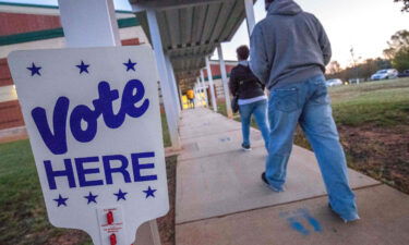 Voters arrive at Waddell Language Academy in Charlotte