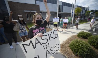 Pro-mask wearing parents stage a protest at the Cobb County School Board headquarters