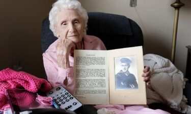 Rose Guilfoyle holds a picture of her brother