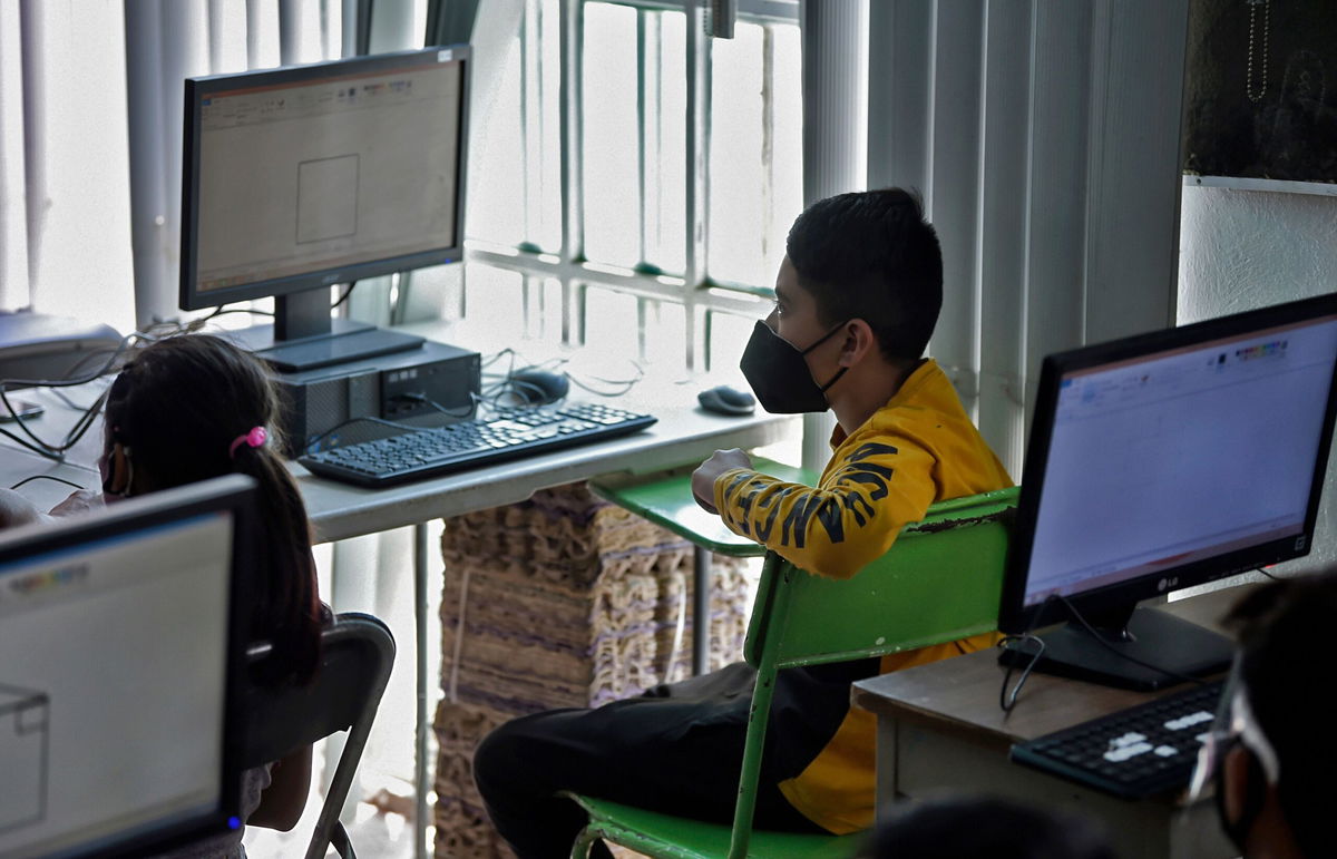 <i>ALFREDO ESTRELLA/AFP/AFP via Getty Images</i><br/>Gael Rojas attends a computer science class at the Escalerillas neighborhood in Chimalhuacan