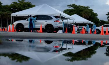 The United States has reached 40 million recorded Covid-19 cases. Pictured is a 24-hour drive-thru site set up by Miami-Dade and Nomi Health in Tropical Park to administer Covid-19 tests.