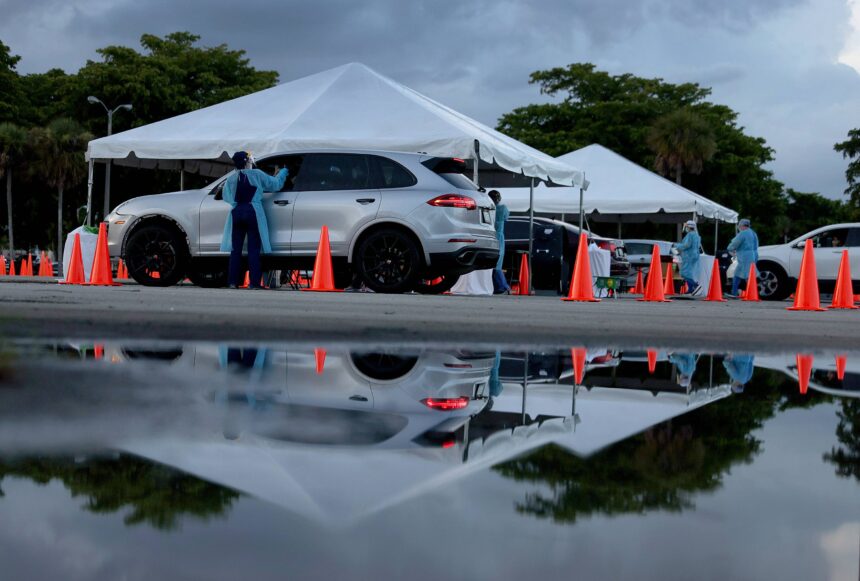 The United States has reached 40 million recorded Covid-19 cases. Pictured is a 24-hour drive-thru site set up by Miami-Dade and Nomi Health in Tropical Park to administer Covid-19 tests.