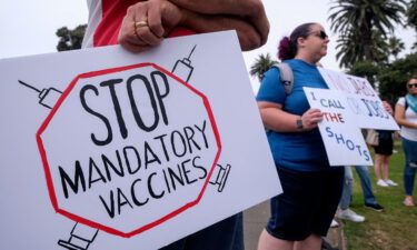 Anti-vaccination protesters hold a rally against Covid-19 vaccine mandates in Santa Monica
