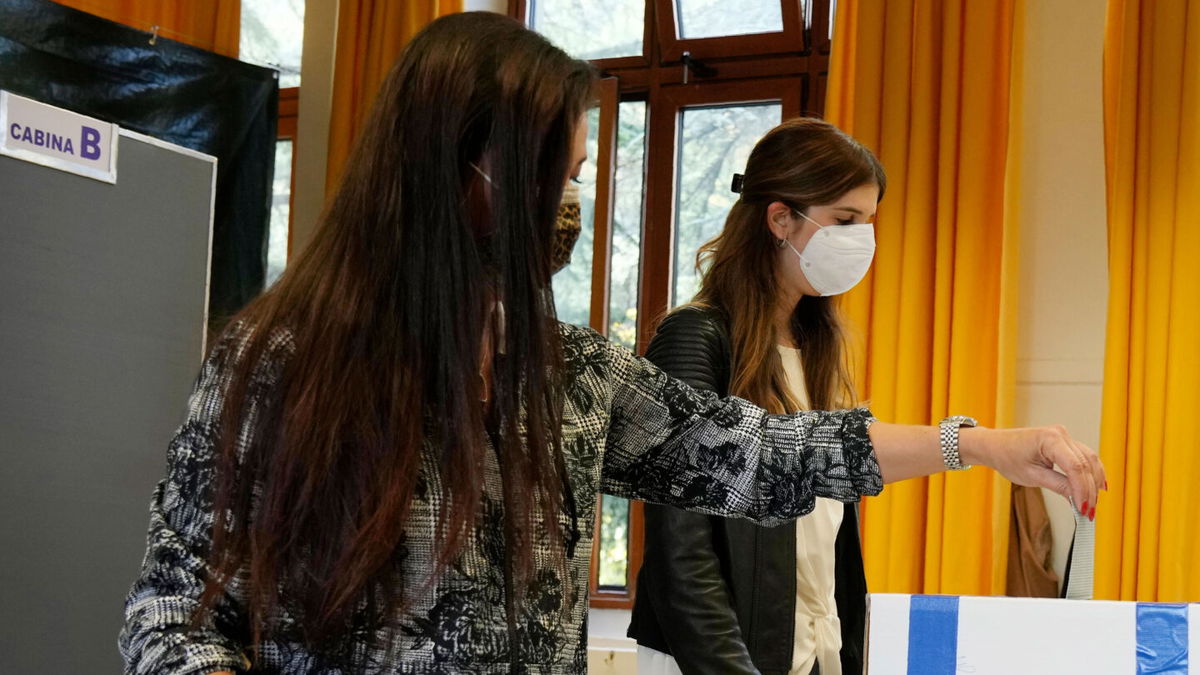 <i>Antonio Calanni/AP</i><br/>A woman casts her ballot for the abortion referendum at a polling station in San Marino