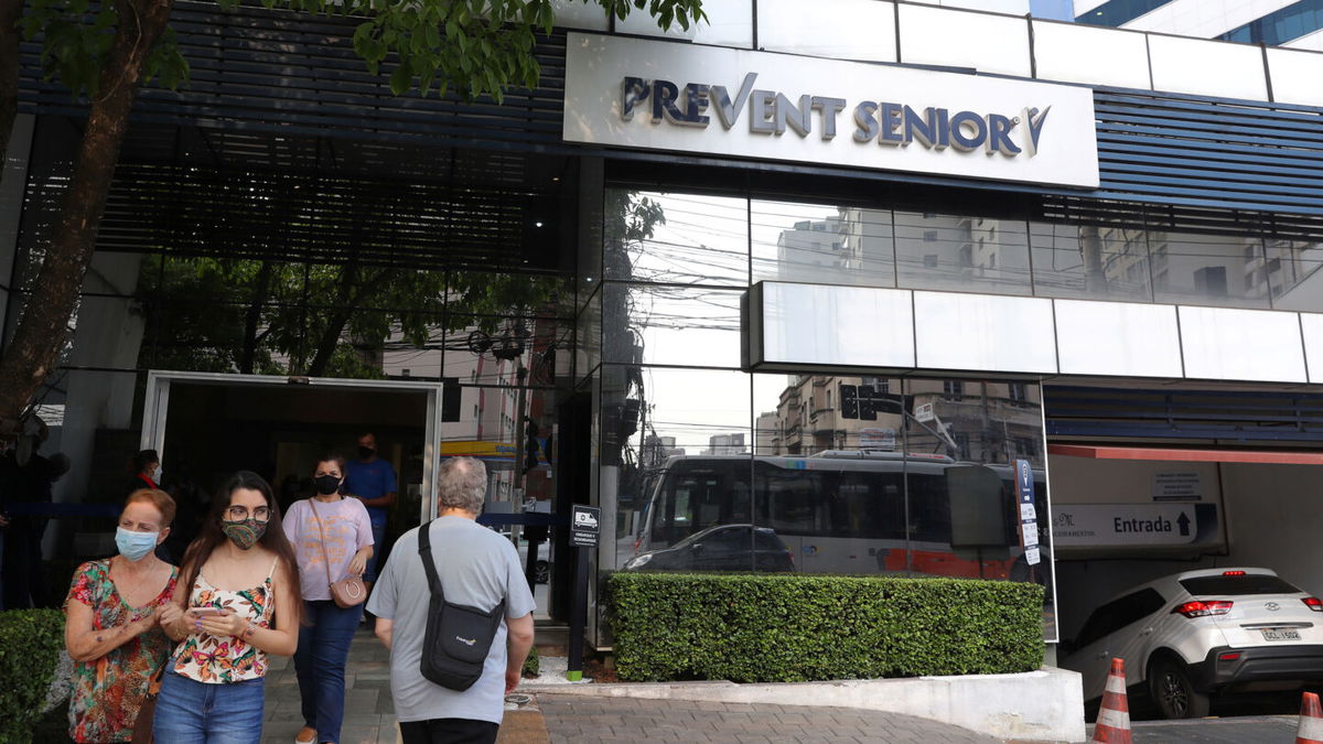 <i>Amanda Perobelli/Reuters</i><br/>People pass by the entrance of a Prevent Senior hospital in Sao Paulo