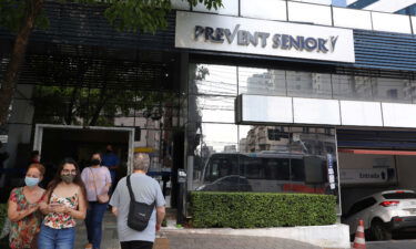 People pass by the entrance of a Prevent Senior hospital in Sao Paulo