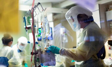 Jack Kingsley R.N. attends to a Covid-19 patient in the Medical Intensive Care Unit at St. Luke's Boise Medical Center in Boise