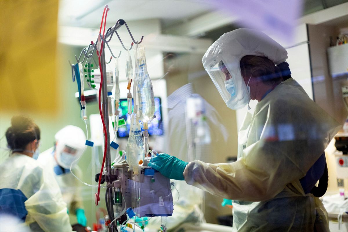 <i>Kyle Green/AP</i><br/>Nurse Jack Kingsley attends to a Covid-19 patient at St. Luke's Boise Medical Center in Boise