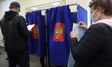 People vote during the last day of the three-day parliamentary and local elections in Russia.