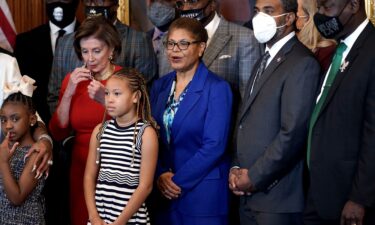 Rep. Karen Bass makes a statement as Speaker Nancy Pelosi