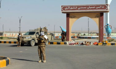 Taliban commando fighters stand guard in Lashkar Gah