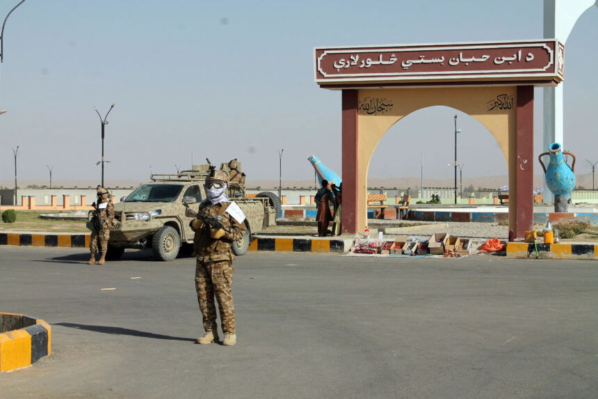 Taliban commando fighters stand guard in Lashkar Gah