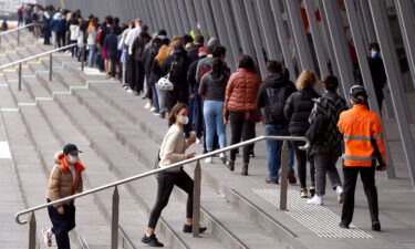 People form long queues outside a vaccination center in Melbourne on Aug. 27. Australia is on track to allow borders to reopen by Christmas