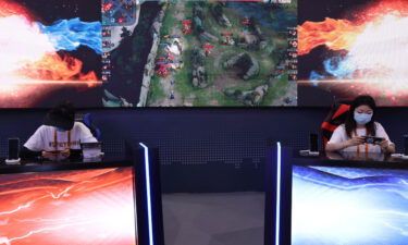 China tells Tencent and Netease to focus less on profit as it expands its crackdown on video gaming. Pictured is a Tencent's video game booth during a trade fair in September in Beijing.