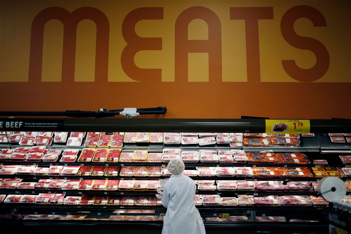 <i>Luke Sharrett/Bloomberg/Getty Images</i><br/>An employee restocks shelves with pork in the meat section at a Kroger Co. supermarket in Louisville
