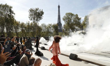 A line of models walk the runway during the Rick Owens fashion show at Paris Fashion Week 2021.