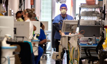 Northeast Georgia Medical Center critical care staff work with Covid-19 patients on Monday