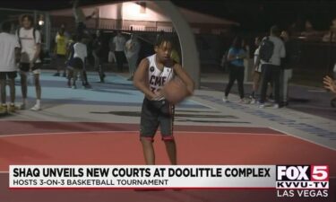 A young man on October 23 shoots baskets on a court donated by former Los Angeles Lakers great Shaquille O'Neal's nonprofit group.