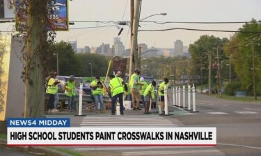 Nashville high school students install glow-in-the-dark crosswalks on October 24.