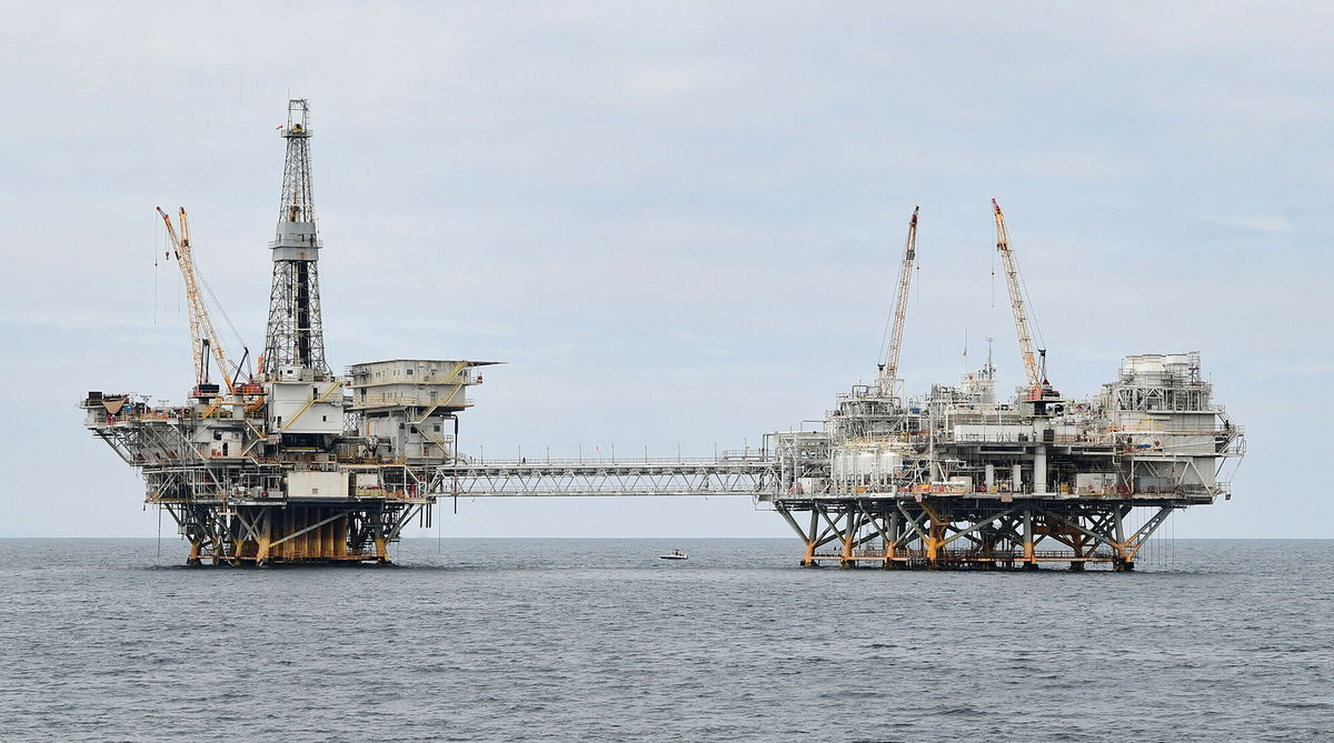 <i>Frederic J. Brown/AFP/Getty Images</i><br/>Experts are warning that the climate crisis could trigger the next financial meltdown. The oil platforms named Ellen (L) and Elly (R) are seen off the southern California coast on October 6