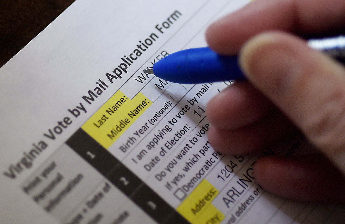 <i>Olivier Douliery/AFP/Getty Images</i><br/>This illustration photo shows a Virginia resident filling out an application to vote by mail ahead of the November Presidential election