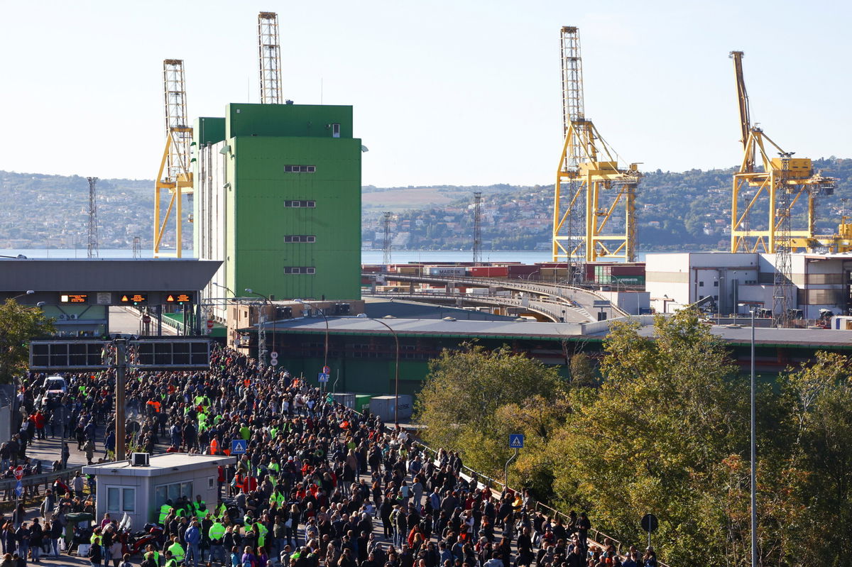 <i>Borut Zivulovic/Reuters</i><br/>People participate in a protest against the implementation of the COVID-19 health pass