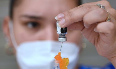 Pfizer and BioNTech said Thursday they are seeking US Food and Drug Administration emergency use authorization from for their Covid-19 vaccine for children ages 5 to 11. Medical assistant Veronica Zaldana is shown here filling a syringe with a dose of the Pfizer COVID-19 vaccine at a vaccination clinic at Winter Springs High School.