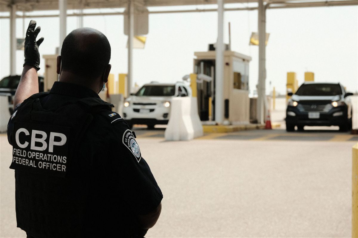 <i>Matthew Hatcher/Getty Images</i><br/>U.S. Customs and Border Protection agents direct vehicles re-entering the U.S. from Canada