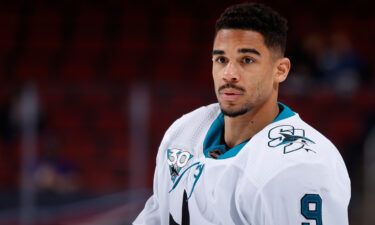The National Hockey League has handed a 21-game unpaid suspension to Evander Kane of the San Jose Sharks after an investigation into whether he submitted a fraudulent Covid-19 vaccination card