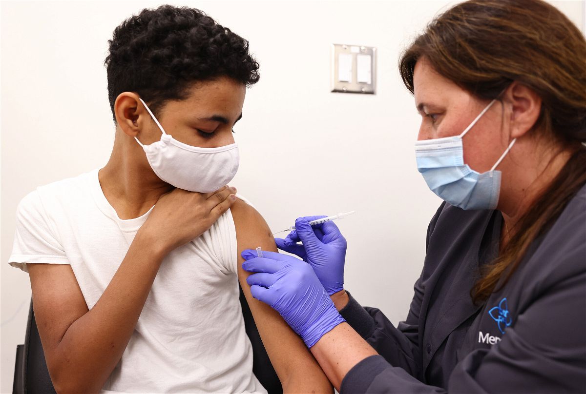 <i>Mario Tama/Getty Images</i><br/>Clinical pharmacist Laura Gaar administers a COVID-19 vaccination dose to a 14-year-old at Lake Charles Memorial Hospital on August 10 in Lake Charles