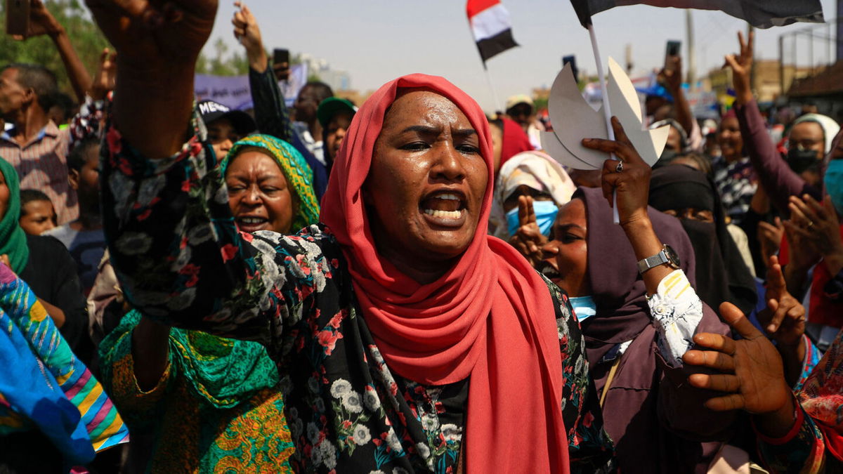 <i>ASHRAF SHAZLY/AFP via Getty Images</i><br/>Protesters marched through the streets chanting anti-military slogans and waving flags.