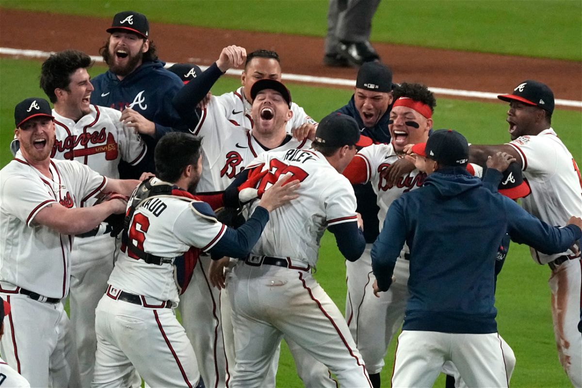 <i>John Bazemore/AP</i><br/>Atlanta Braves celebrate after winning Game 6 of baseball's National League Championship Series against the Los Angeles Dodgers Saturday
