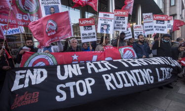 Former shadow chancellor John McDonnell joins a protest outside the UBER HQ in East London during a strike on October 6