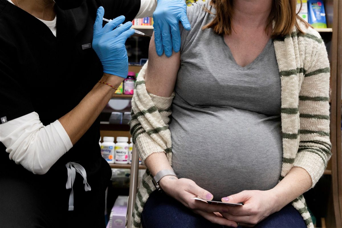<i>Hannah Beier/Reuters</i><br/>A pregnant woman receives a vaccine for the coronavirus disease (COVID-19) at Skippack Pharmacy in Schwenksville