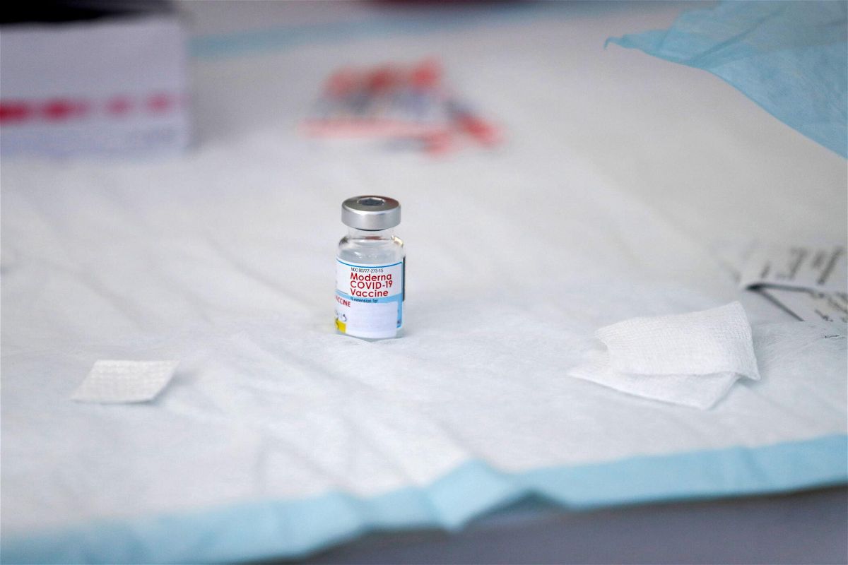 <i>Caroline Brehman/EPA-EFE/Shutterstock</i><br/>A vial containing Moderna Covid-19 vaccine sits on a table at a clinic for individuals experiencing homelessness at San Julian Park in Los Angeles