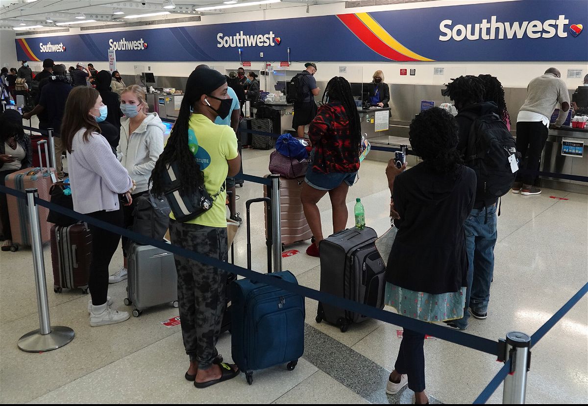 <i>Joe Cavaretta/South Florida Sun-Sentinel/AP</i><br/>Passengers wait in line at the Southwest Airlines ticket counter at Fort Lauderdale Hollywood International Airport
