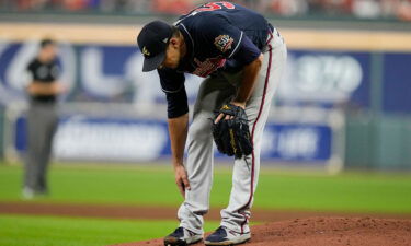 Atlanta Braves starting pitcher Charlie Morton rubs his leg before leaving the game during the third inning of Game 1 of the World Series on Tuesday.