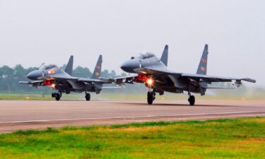 In this undated file photo two Chinese SU-30 fighter jets take off from an unspecified location to fly a patrol over the South China Sea. China flew more than 30 military planes