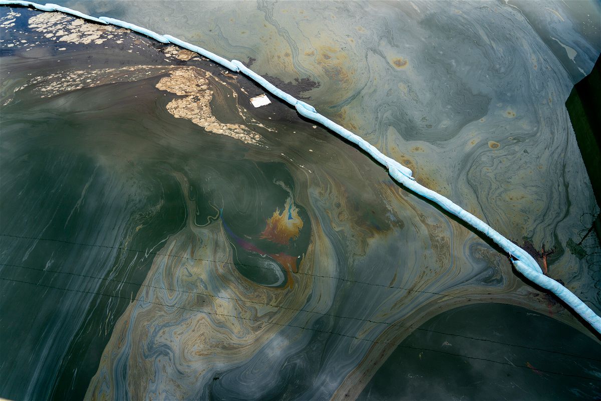 <i>Kyle Grillot for CNN</i><br/>Boom traps oil under the Talbert Channel in an area affected by the oil spill off the coast of Huntington Beach