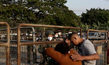 Relatives of prisoners await news outside the Litoral penitentiary in Guayaquil on Sept. 29.