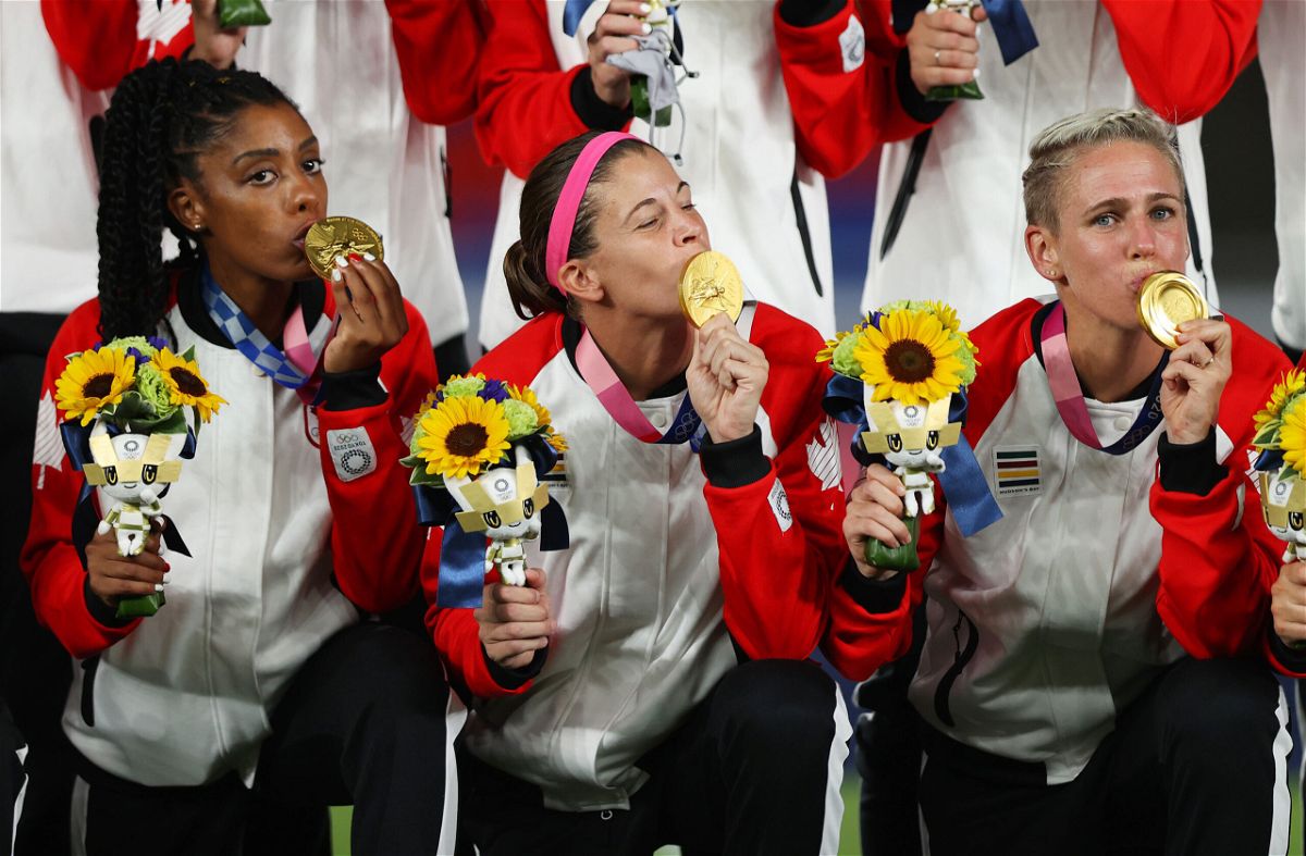<i>Naomi Baker/Getty Images</i><br/>Labbe kisses her Olympic gold medal