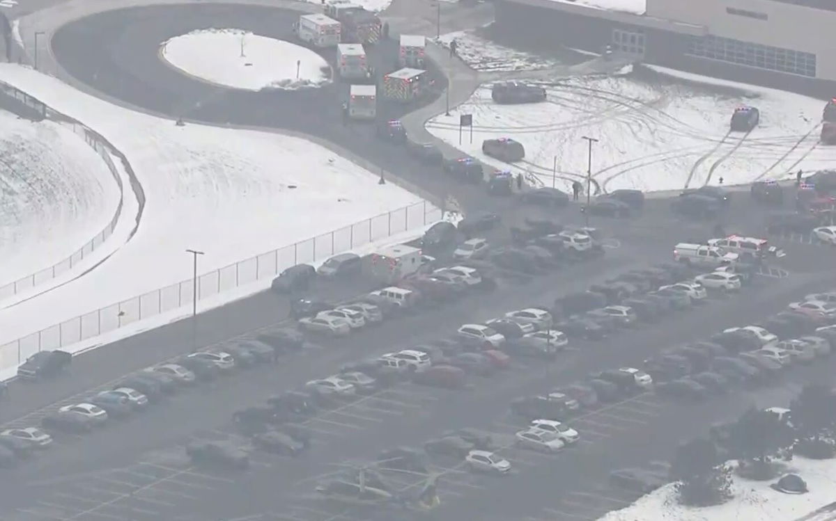 <i>WNEM</i><br/>First response vehicles are seen in the parking lot of Oxford High School where a suspected school shooting was reported and a suspected shooter is in custody