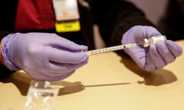 A nurse prepares a dose of a Johnson & Johnson Covid-19 vaccine in Chicago.