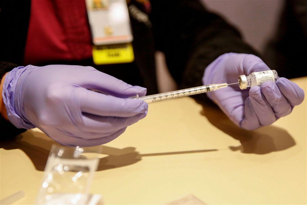 <i>Kamil Krzaczynski/AFP/Getty Images</i><br/>A nurse prepares a dose of a Johnson & Johnson Covid-19 vaccine in Chicago.